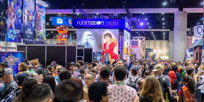 Attendees walking through an exhibit hall during Comic-Con 2018.